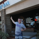 Mark McGuire, a N.Y. Giants football fan, stands near the front door of the Orchids of Asia Day Spa after New England Patriots owner Robert Kraft is charged with allegedly soliciting for sex.